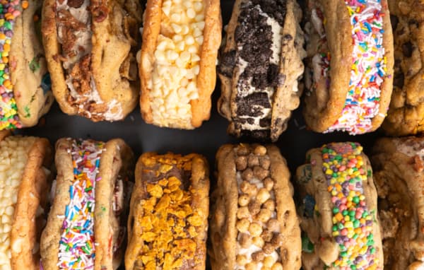 A variety of Smooshies ice cream sandwiches stacked next to each other.